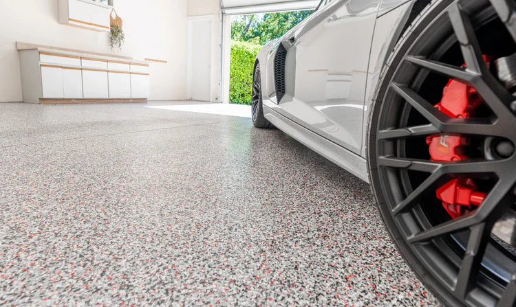 Finished flake epoxy garage floor with high-gloss topcoat ready for use in Simi Valley, CA
